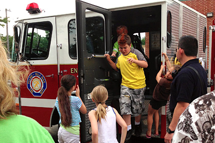 Kids Climbing out of a Fire Truck